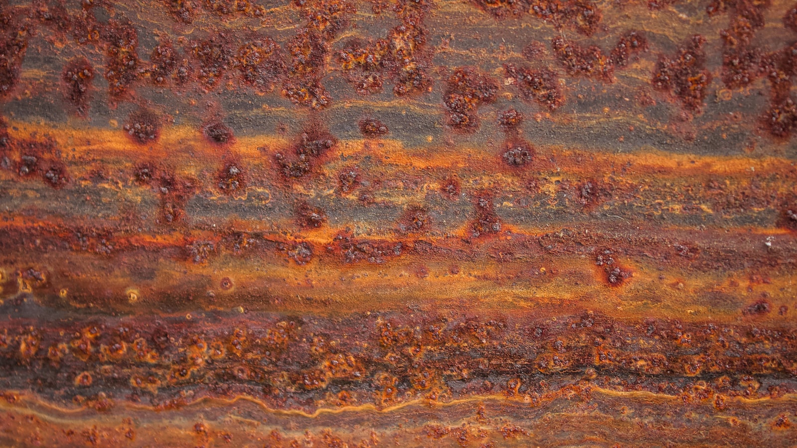 Close-up of rusted metal texture representing oxidation